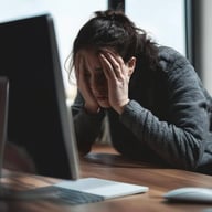person struggling in front of computer